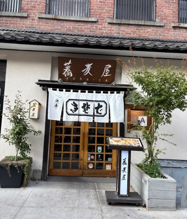 Chef carefully preparing soba noodles by hand